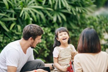 Happy mixed-race girl with parents